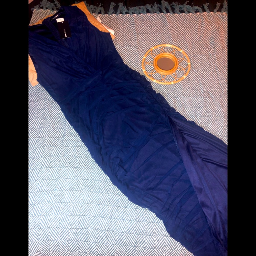 Gorgeous navy blue evening dress with rouche and slit.